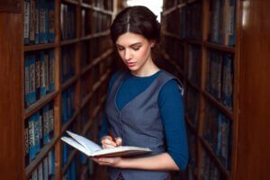 Woman reading in a library.