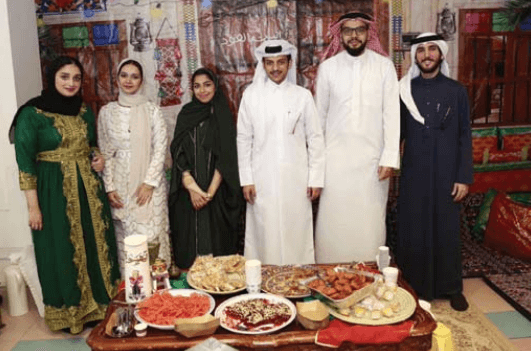 Students/staff in traditional attire at a social event