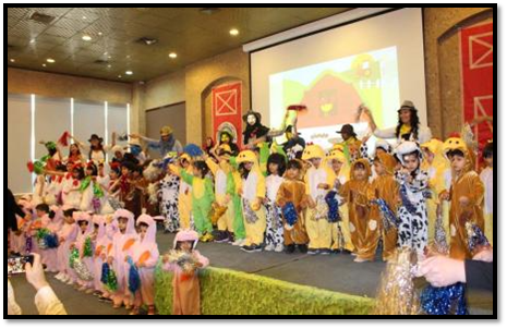 Children in farm costumes at preschool annual show