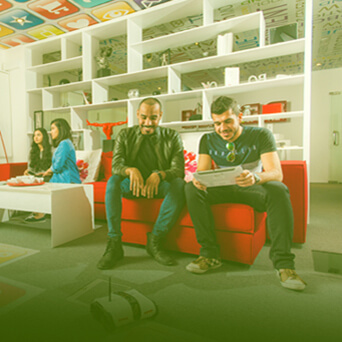 Interior of Ahlia University Library showing bookshelves and study spaces
